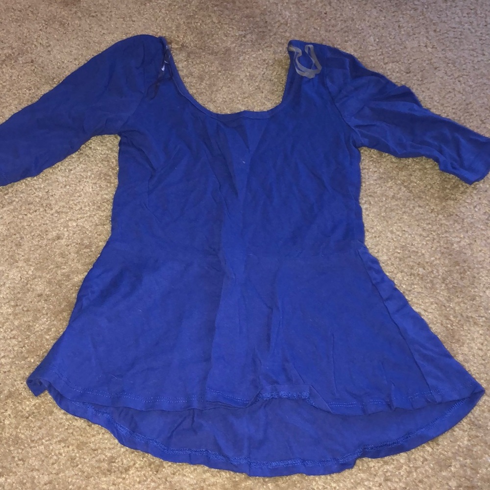 Tight on waist flowy on bottom half sleeve shirt